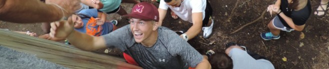 Evan on the ropes course last summer